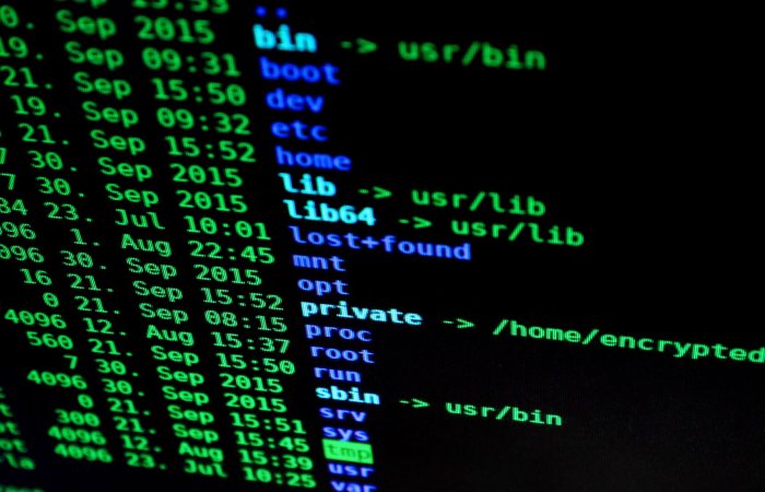 Close-up of colorful text on a computer screen, showcasing cybersecurity concepts.